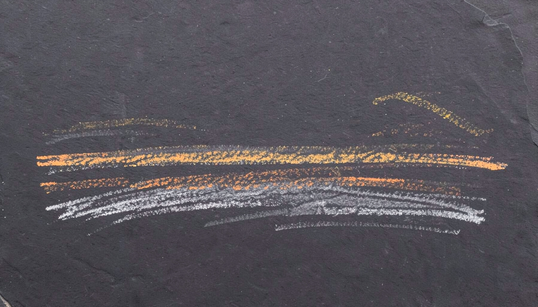 Chalk sketch on a dark slate board, soft amber and grey lines suggesting a low horizon at dawn